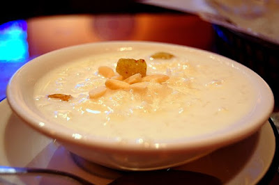 Creamy rice kheer garnished with nuts, a traditional Indian dessert