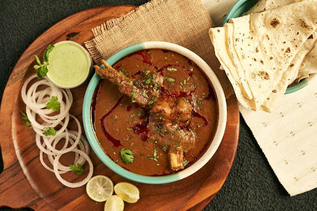 homemade indian mutton curry with roti soft slow cooked goat curry