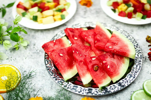 Fresh watermelon slices served on a plate for summer hydration